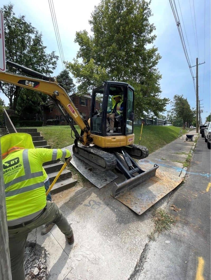 Roadside construction crew digging for a horizontal directional drilling application